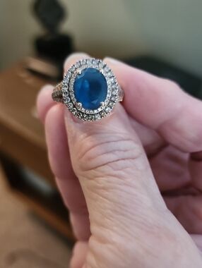 LeVian London Blue Topaz Oval Halo Ring with Chocolate Pavé Diamonds. 14Kt gold